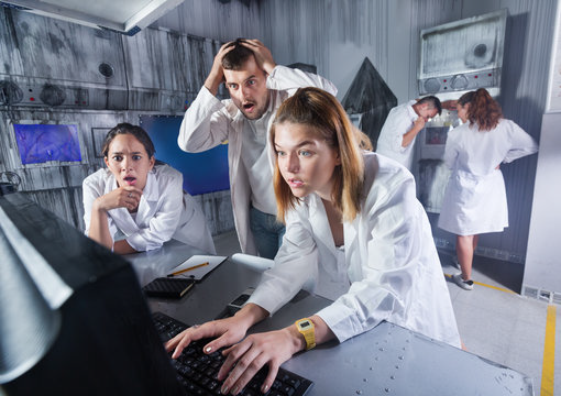 adults trying to get out of escape room